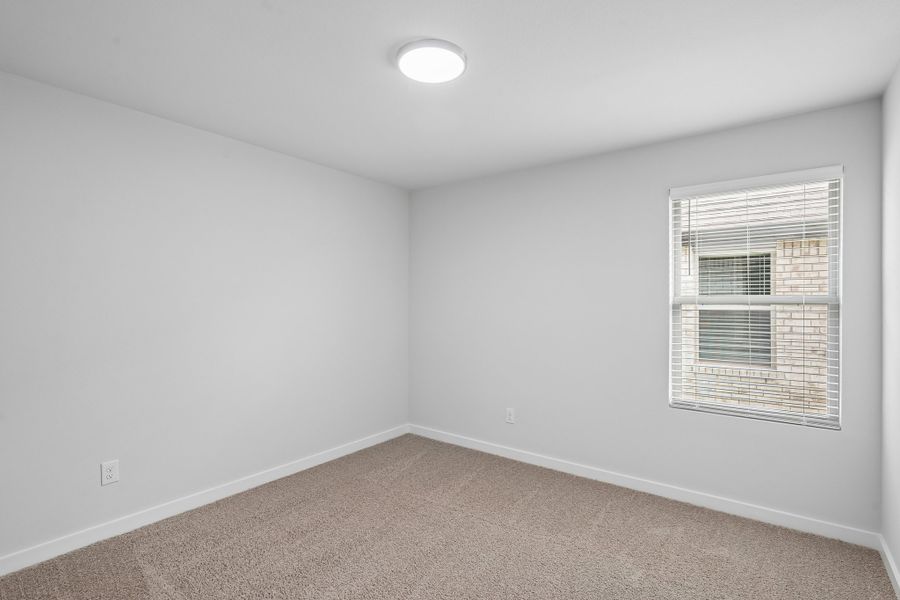 Bedroom in the Hayden home plan by Trophy Signature Homes