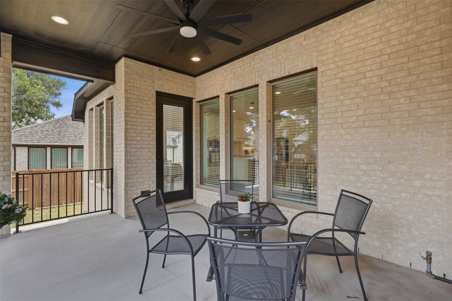 An inviting covered patio offers seamless indoor-outdoor living, perfect for relaxation and entertainment.