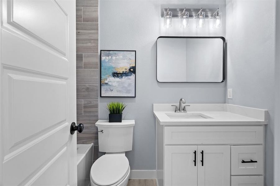 Full bathroom with vanity and toilet Full bathroom with vanity and toilet