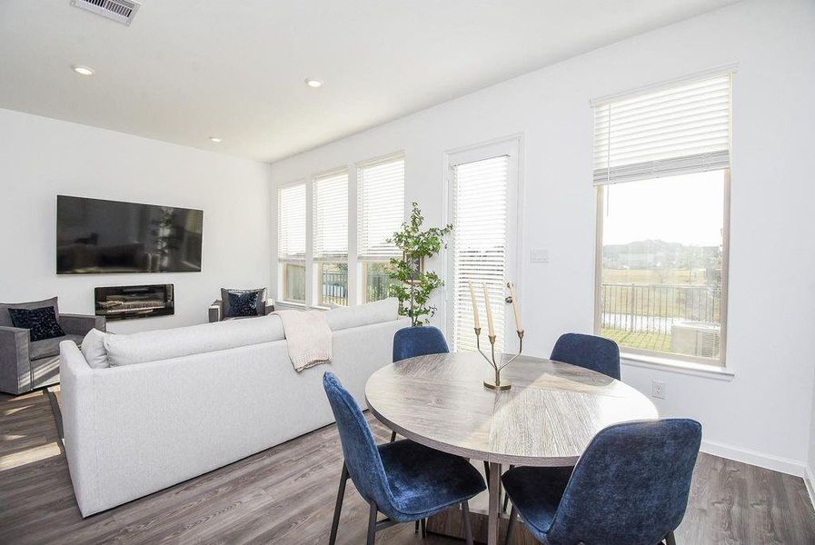 Open-concept dining and kitchen space with clean lines and natural light that elevates everyday living.