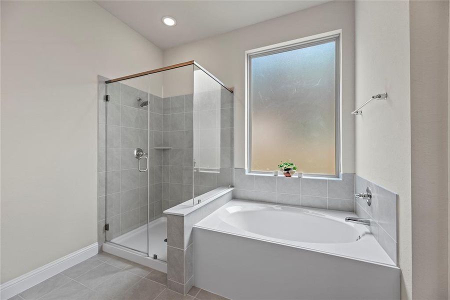 Indulge in luxury and relaxation! The Primary Suite features separate walk-in showers and a deep soaking tub, offering the perfect sanctuary to wash away the cares of the day.