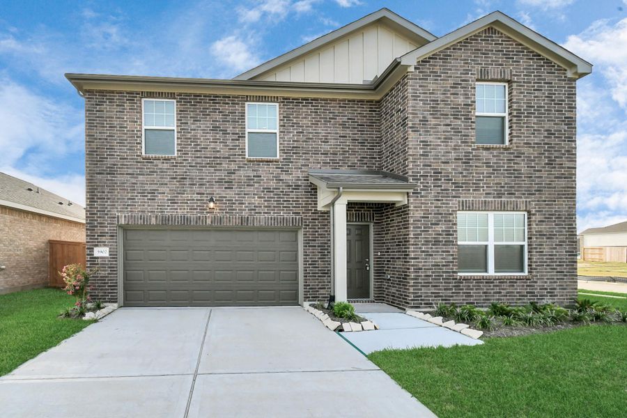 Front exterior of a new home in Sunterra, Katy, TX, highlighting curb appeal (Image 21).