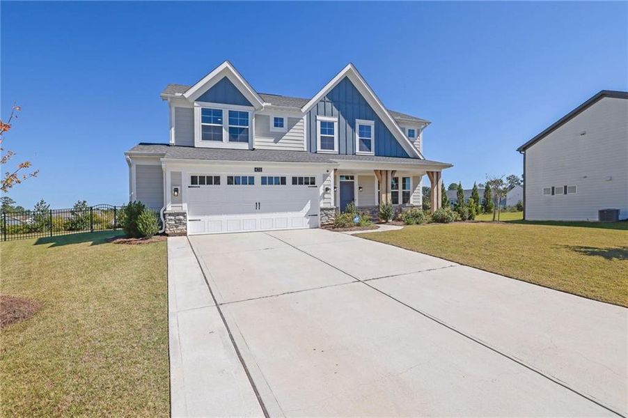 Front exterior of a new home in Sweetbay Farm, Lawrenceville, GA, highlighting curb appeal (Image 24).