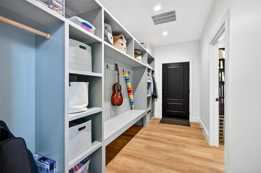 Mudroom featuring light wood-style floors and recessed lighting Mudroom featuring light wood-style floors and recessed lighting