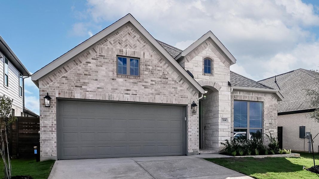 Front exterior of a new home in Juniper Springs, Lockhart, TX, highlighting curb appeal (Image 2). Front exterior of a new home in Juniper Springs, Lockhart, TX, highlighting curb appeal (Image 2).