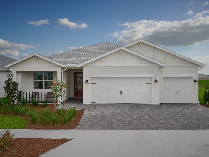 Front exterior of a new home in Crescent Lakes - Signature Series, Punta Gorda, FL, highlighting curb appeal (Image 1).