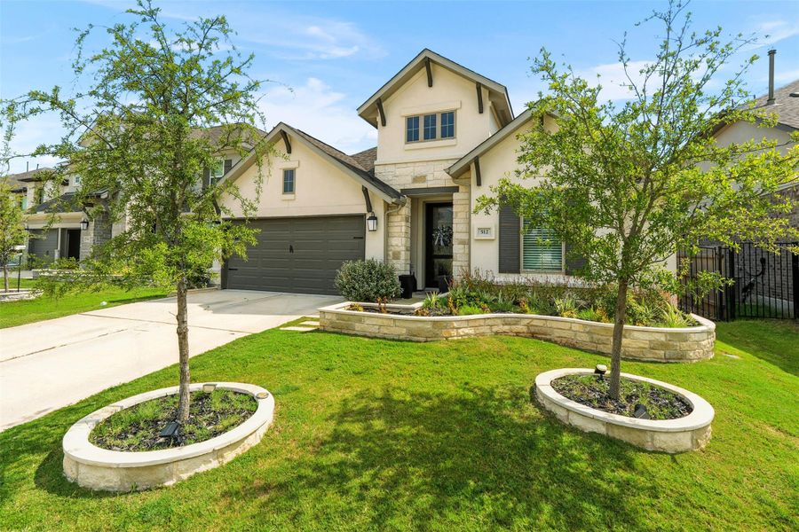 Front exterior of a new home in Santa Rita Ranch 50', Liberty Hill, TX, highlighting curb appeal (Image 2). Front exterior of a new home in Santa Rita Ranch 50', Liberty Hill, TX, highlighting curb appeal (Image 2).