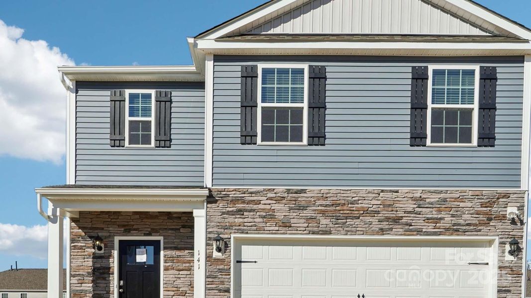 Front exterior of a new home in Wallace Springs, Statesville, NC, highlighting curb appeal (Image 17). Front exterior of a new home in Wallace Springs, Statesville, NC, highlighting curb appeal (Image 17).