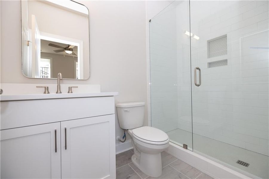 Ensuite Full bathroom in terrace bedroom featuring upgraded cabinets - and quartz or marble tops. Image is of previously built Chamberlain