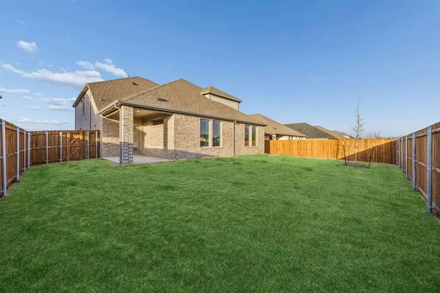 Covered Patio in the Wimbledon home plan by Trophy Signature Homes – REPRESENTATIVE PHOTO Covered Patio in the Wimbledon home plan by Trophy Signature Homes – REPRESENTATIVE PHOTO