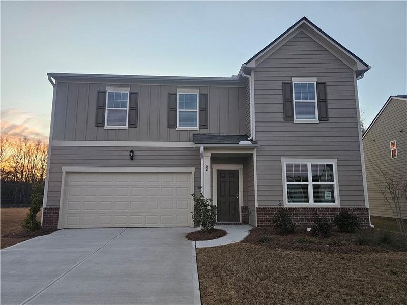 Front exterior of a new home in Casteel, Bethlehem, GA, highlighting curb appeal (Image 2). Front exterior of a new home in Casteel, Bethlehem, GA, highlighting curb appeal (Image 2).
