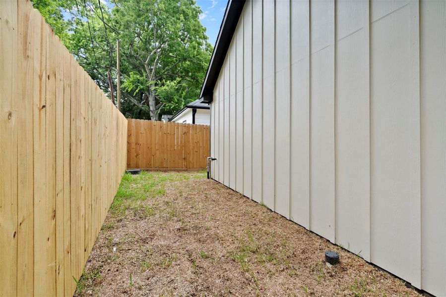 Another view of fenced back yard space. Another view of fenced back yard space.