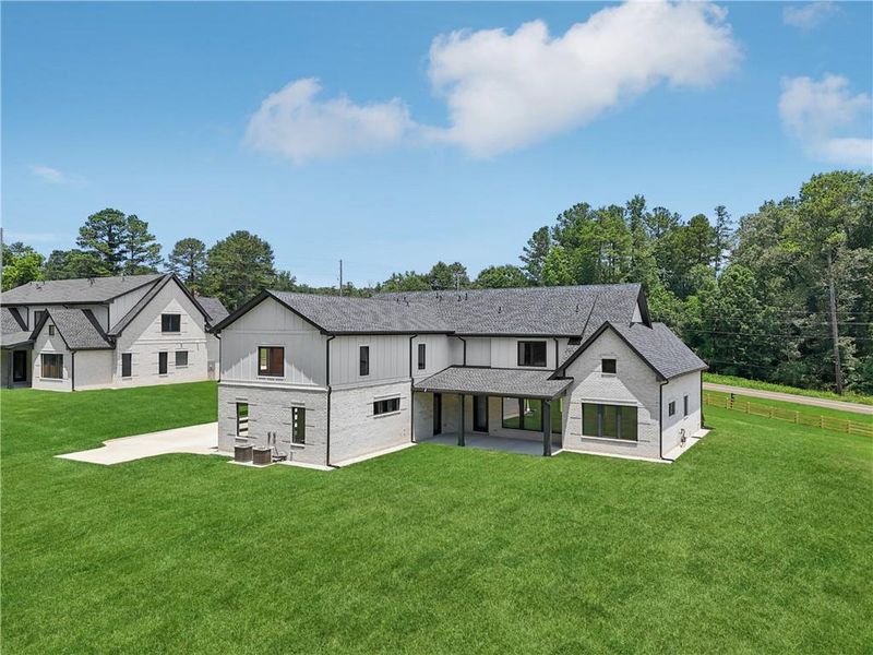 Front exterior of a new home in , Braselton, GA, highlighting curb appeal (Image 49).