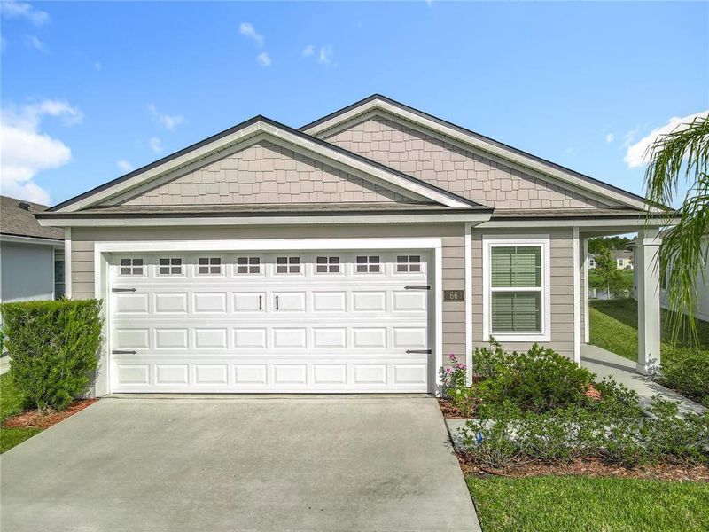 Front exterior of a new home in , Bunnell, FL, highlighting curb appeal (Image 20).