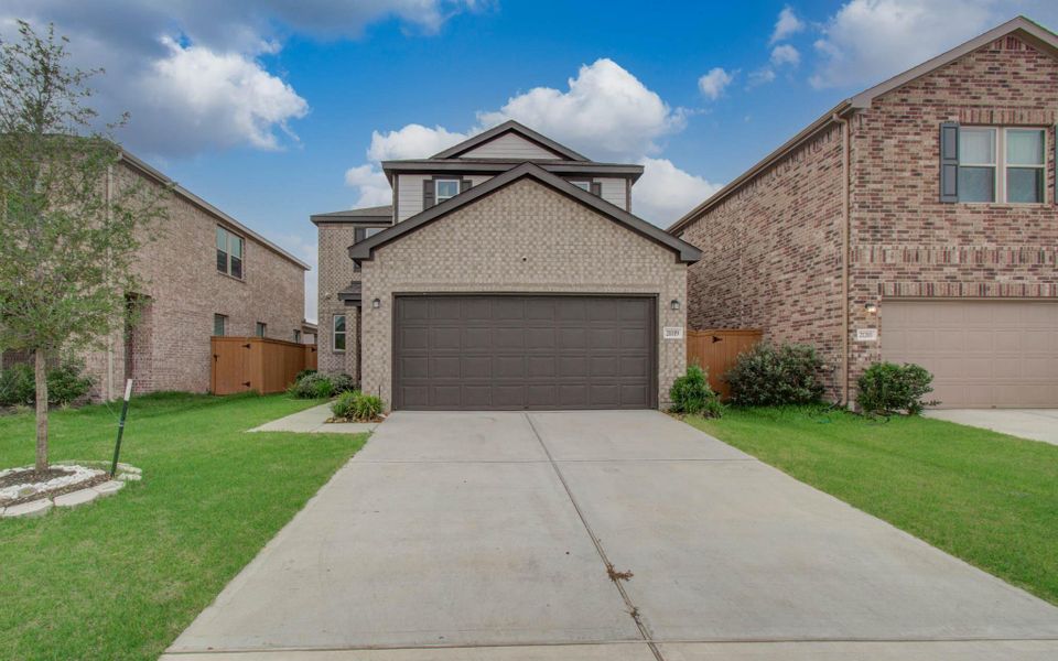 Front exterior of a new home in , Cypress, TX, highlighting curb appeal (Image 25). Front exterior of a new home in , Cypress, TX, highlighting curb appeal (Image 25).