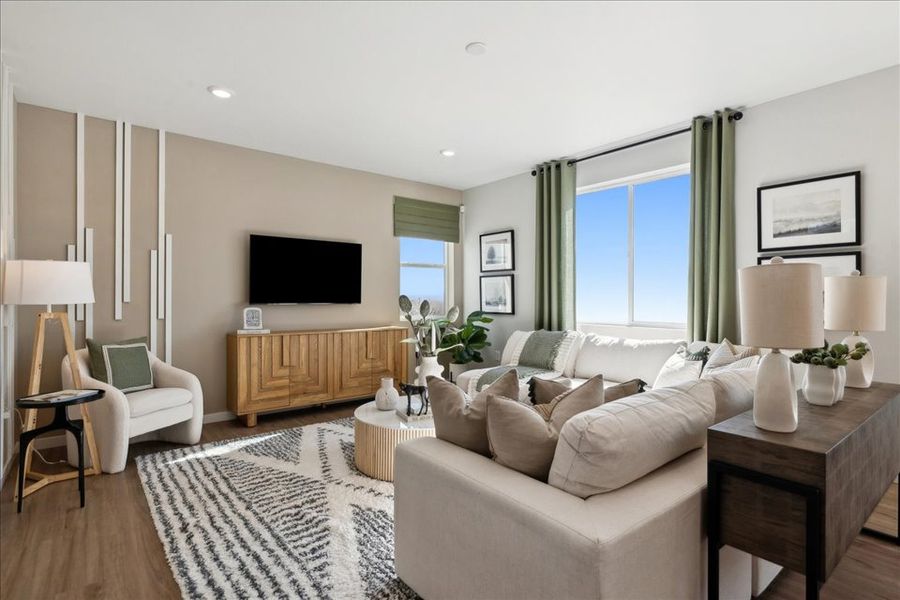 A living room with a large window. A living room with a large window.