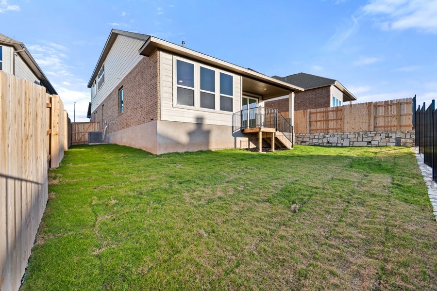 Exterior details and patio area of a home in Lariat, Liberty Hill (Image 29).