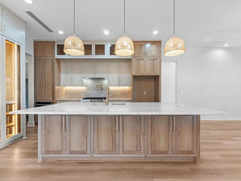 You'll find custom cabinetry throughout, but the details here are; white oak cabinetry, glass face cabinets, luxury appliances, and much much more.