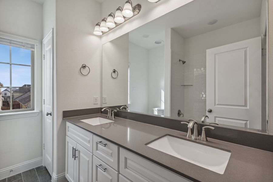 Representative furnished interior of a home built from the Lakefront II by Megatel Homes in Santorini, Seagoville (Image 8).