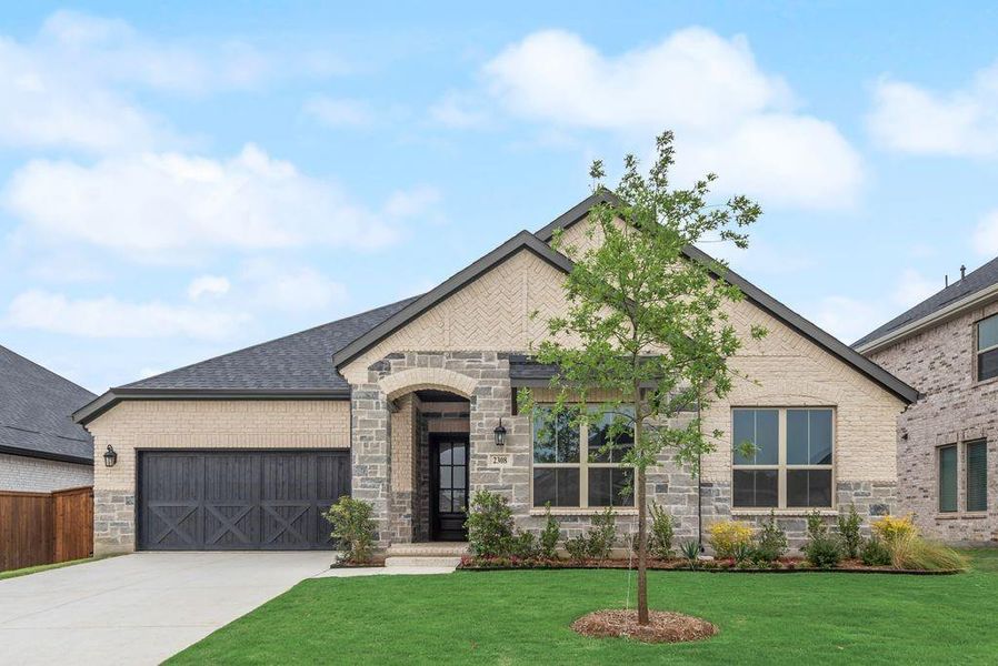 Front exterior of a new home in Valencia On The Lake, Little Elm, TX, highlighting curb appeal (Image 2).