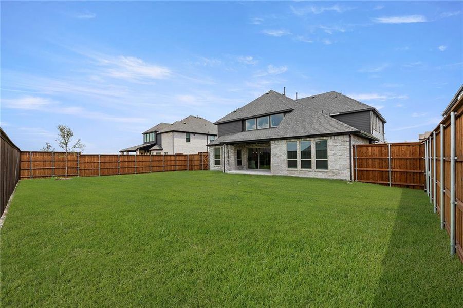 Front exterior of a new home in Cambridge Estates, Prosper, TX, highlighting curb appeal (Image 16). Front exterior of a new home in Cambridge Estates, Prosper, TX, highlighting curb appeal (Image 16).