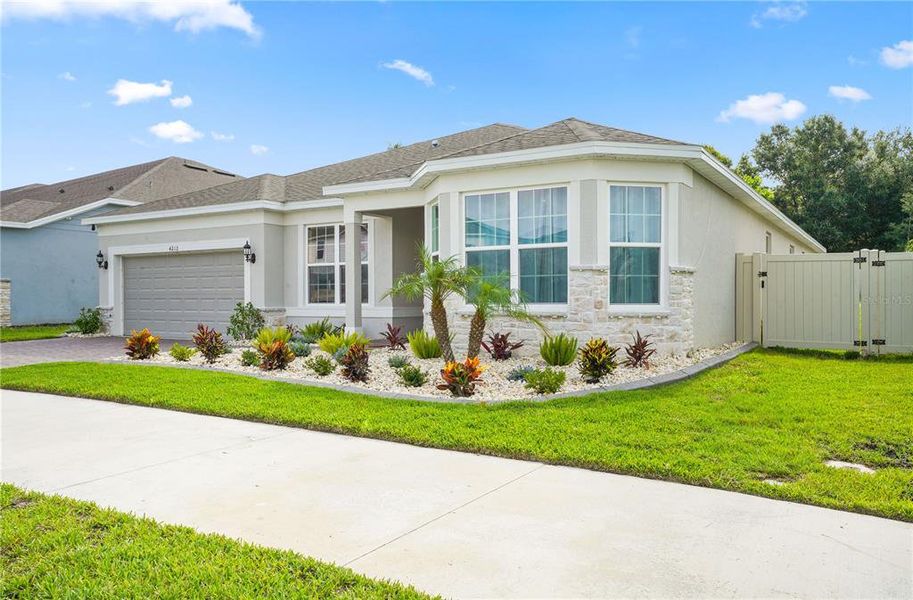 Front exterior of a new home in Winding Meadows, Apopka, FL, highlighting curb appeal (Image 25).