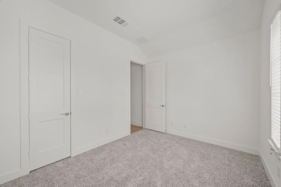 Representative unfurnished interior of a home built from the Mariah by Chesmar Homes in Lakes of Cane Island, Katy (Image 18).