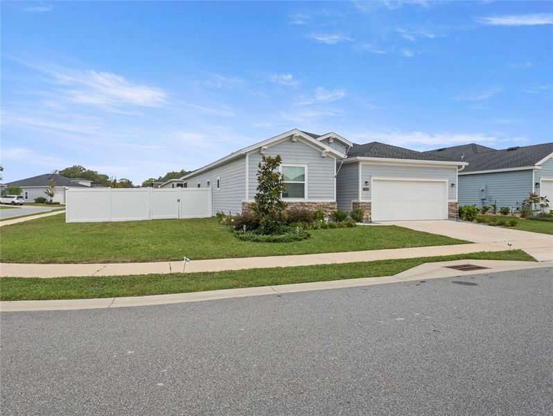 Front exterior of a new home in Liberty Village: Liberty Village - Phase One, Ocala, FL, highlighting curb appeal (Image 22).