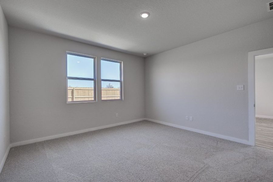 A room with a window and a door.