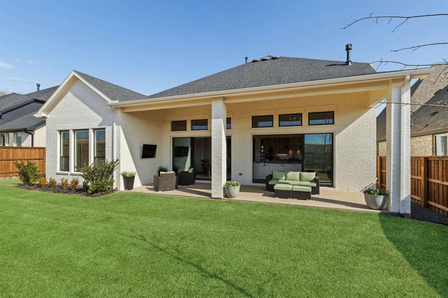 Two sliding glass doors connect indoor and outdoor living Two sliding glass doors connect indoor and outdoor living