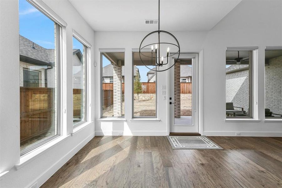 Breakfast nook in the kitchen looks over the living room and backyard