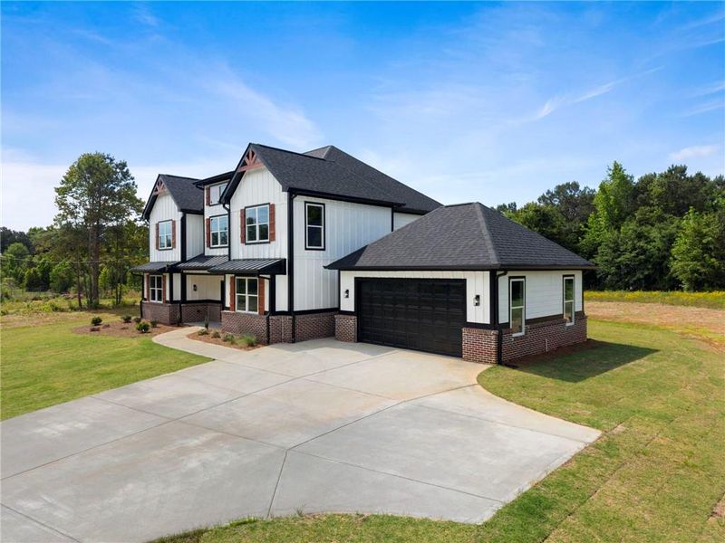 Front exterior of a new home in , Locust Grove, GA, highlighting curb appeal (Image 21).
