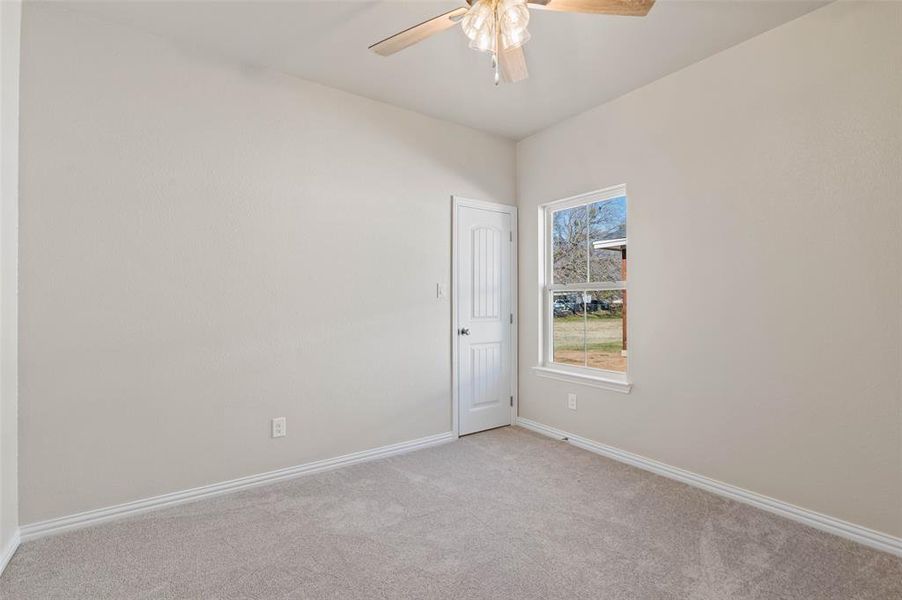 Carpeted spare room featuring ceiling fan Carpeted spare room featuring ceiling fan