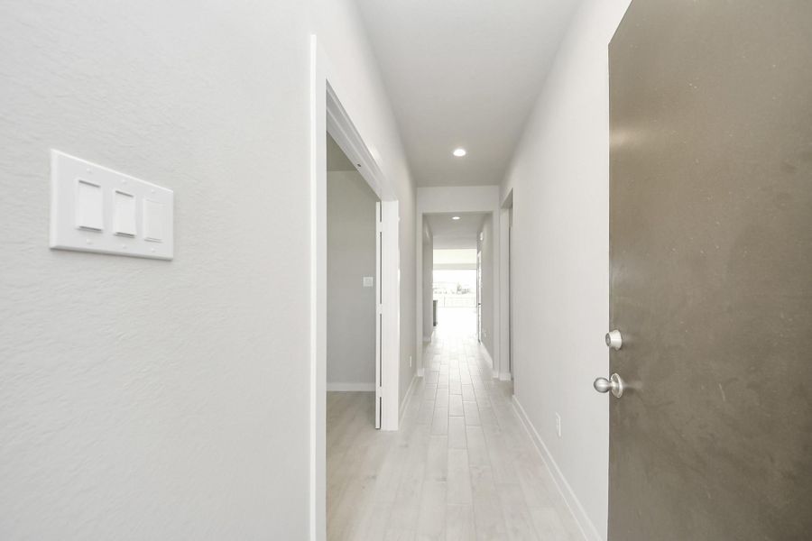 As you step into the threshold of this luxurious home, you'll soon be welcomed by an elegant glass door (to be installed). Inside, soaring ceilings amplify the spaciousness, while the refined wood-look tile flooring and oversized baseboards exude sophistication and charm. As you step into the threshold of this luxurious home, you'll soon be welcomed by an elegant glass door (to be installed). Inside, soaring ceilings amplify the spaciousness, while the refined wood-look tile flooring and oversized baseboards exude sophistication and charm.