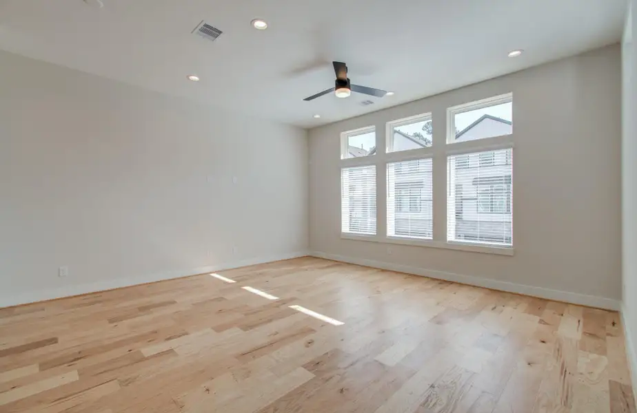 Your new living room is an architectural masterpiece—boasting soaring ceilings, wide wood plank floors, and extended windows that invite the sunlight to dance across the room. It’s the perfect canvas for your personal style.