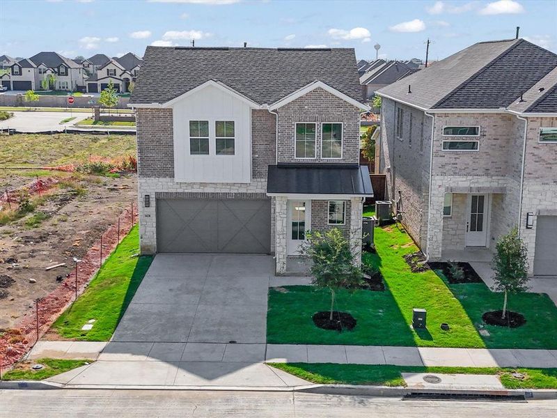 Front exterior of a new home in Royal Court, Little Elm, TX, highlighting curb appeal (Image 2).