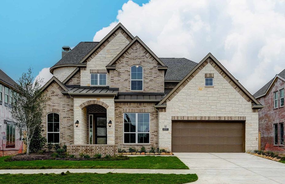 Representative exterior photo of a completed home built from the 3799 by Ravenna Homes in Cross Creek West, Fulshear, TX (Image 26). Representative exterior photo of a completed home built from the 3799 by Ravenna Homes in Cross Creek West, Fulshear, TX (Image 26).
