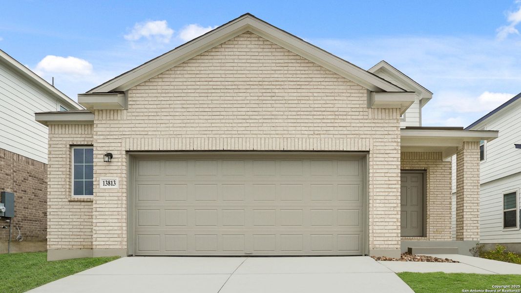 Front exterior of a new home in Cinco Lakes, San Antonio, TX, highlighting curb appeal (Image 1).
