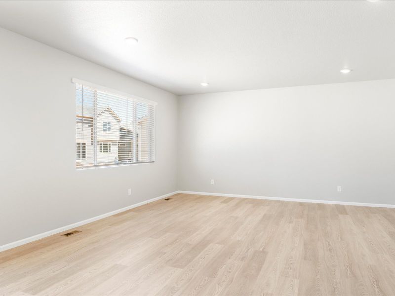 Living area in the Wateron floorplan at a Meritage Homes community in Brighton, CO.