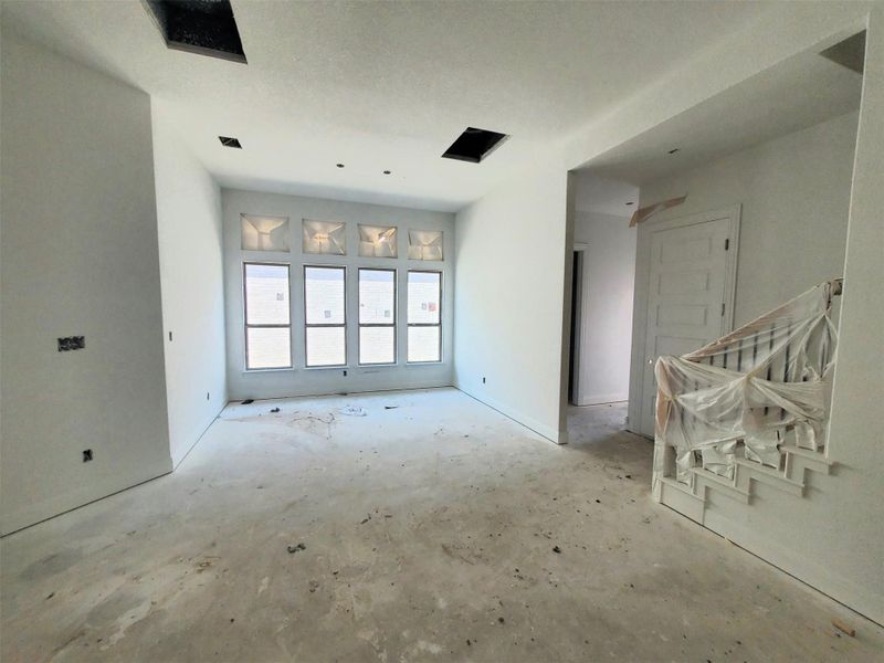 Empty room featuring concrete floors
