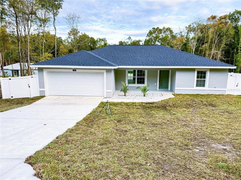 Front exterior of a new home in , Belleview, FL, highlighting curb appeal (Image 18).
