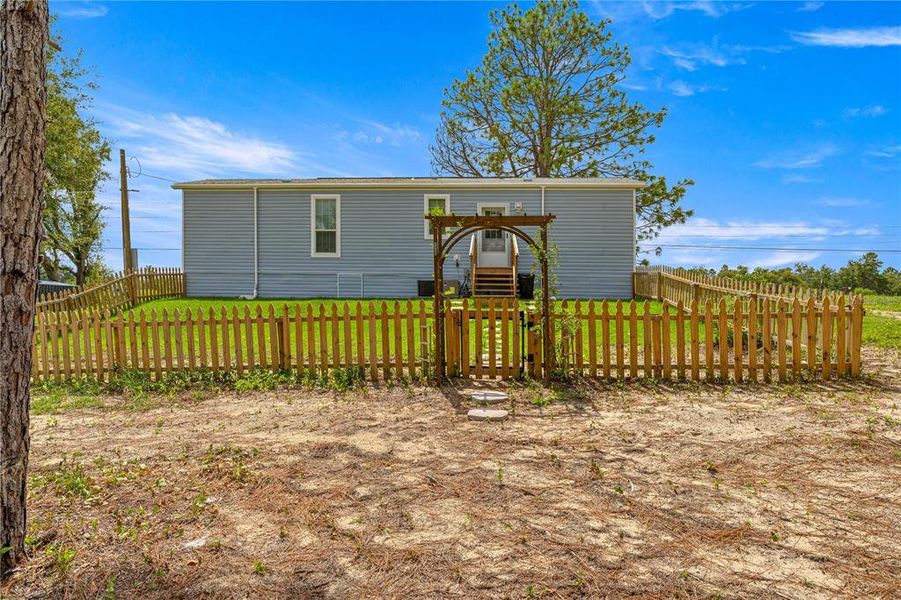 Front exterior of a new home in , Ocklawaha, FL, highlighting curb appeal (Image 12).