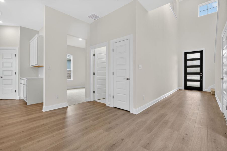 Entrance foyer with light wood-style flooring