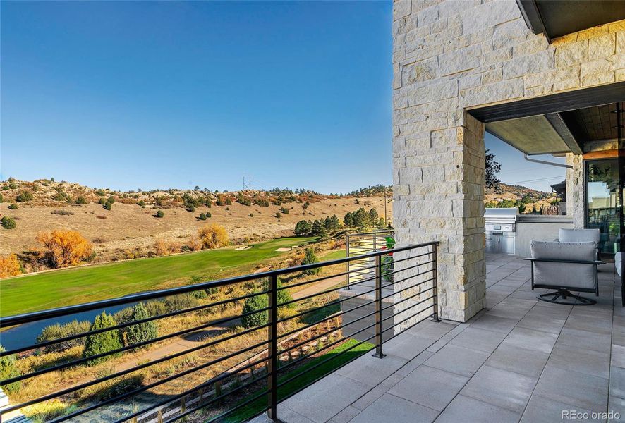 Spanning the great room and primary suite, the upper terrace is an outdoor living room suspended above the awe inspiring landscape.