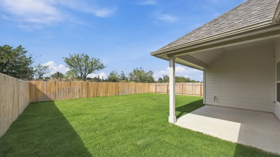 Exterior details and patio area of a home in Carillon, Manor (Image 3).