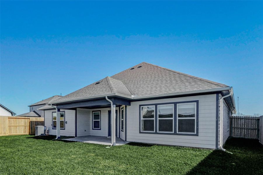 Covered outdoor patio perfect for relaxing, grilling, or outdoor dining.