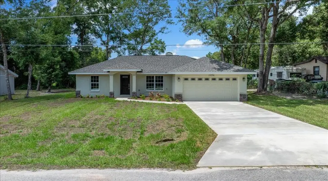 Front exterior of a new home in , Belleview, FL, highlighting curb appeal (Image 18).