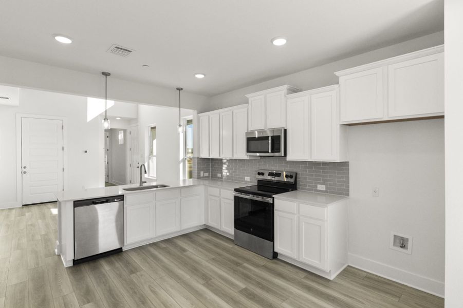 Furnished interior view inside a new home in Avery Centre, Round Rock (Image 6).