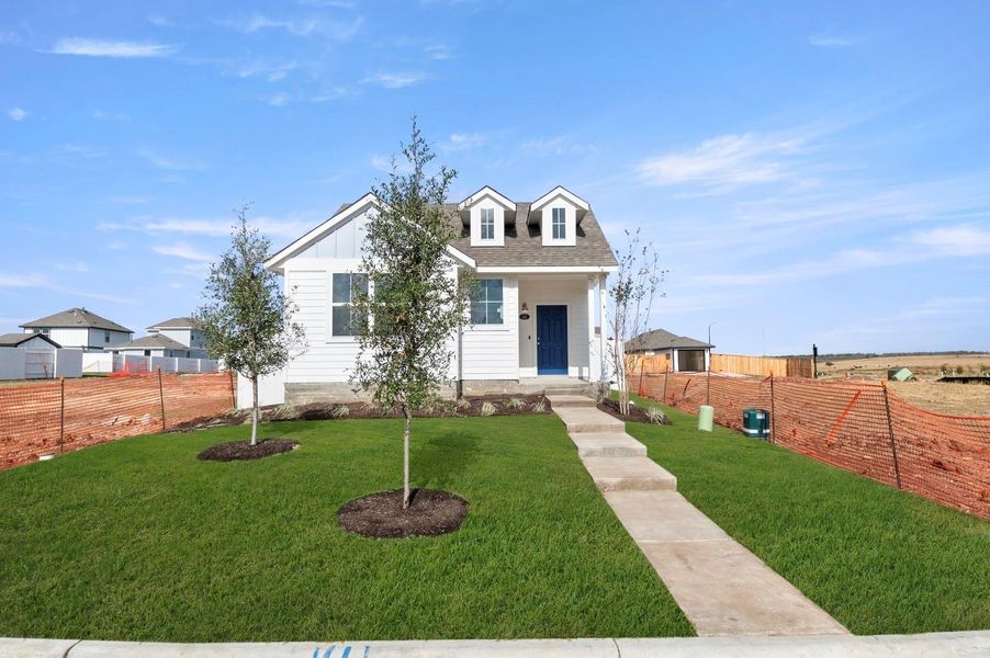 Front exterior of a new home in Harvest Ridge, Elgin, TX, highlighting curb appeal (Image 18).