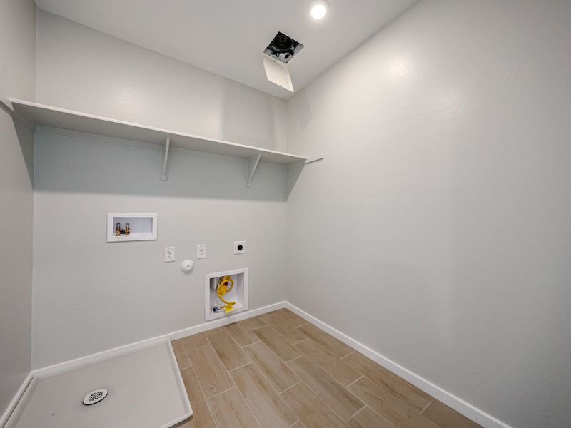 A room with a wood floor and white walls. A room with a wood floor and white walls.
